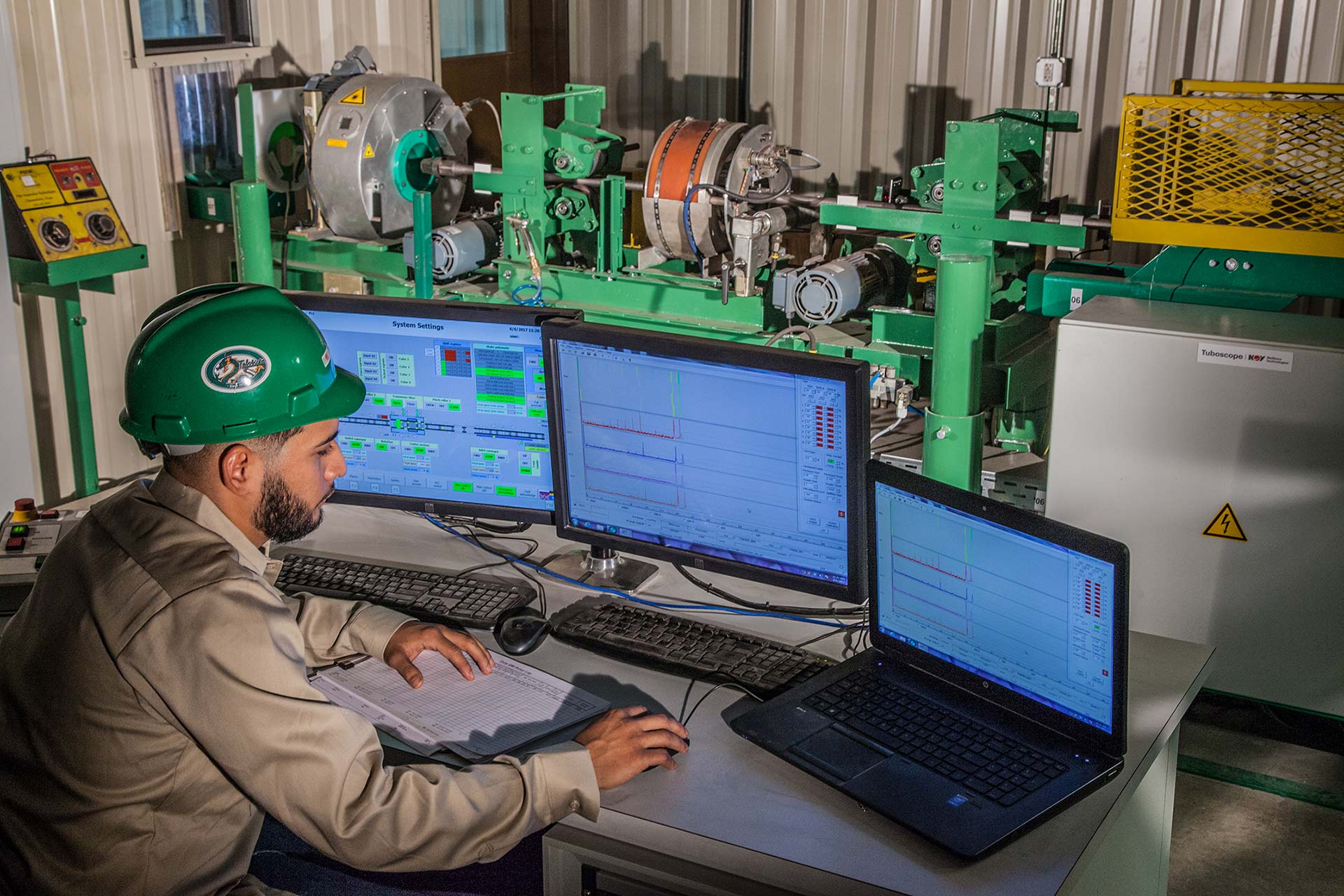 Sucker Rod Inspection Service technician at workstation