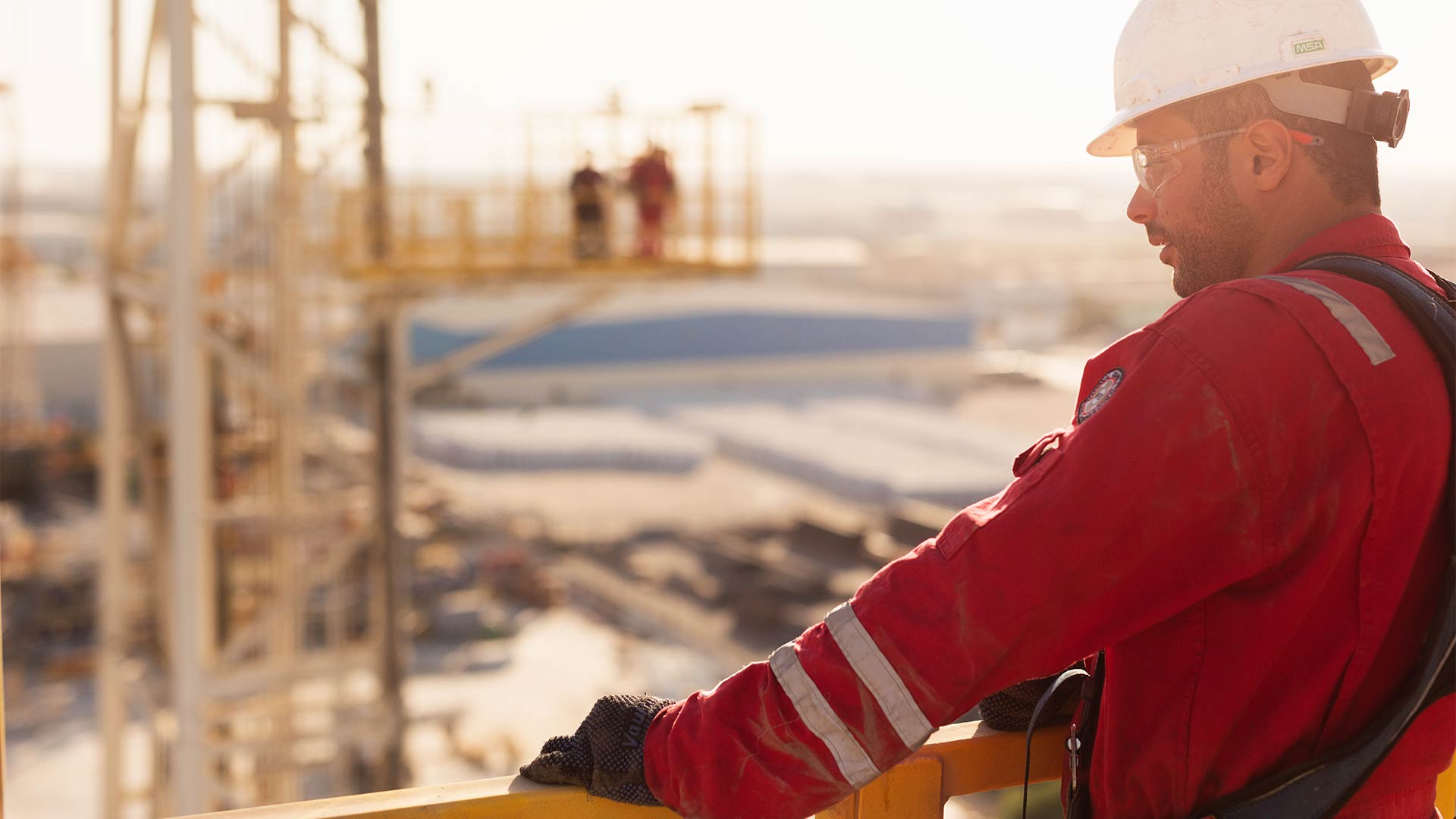 Service technician looking at rigsite
