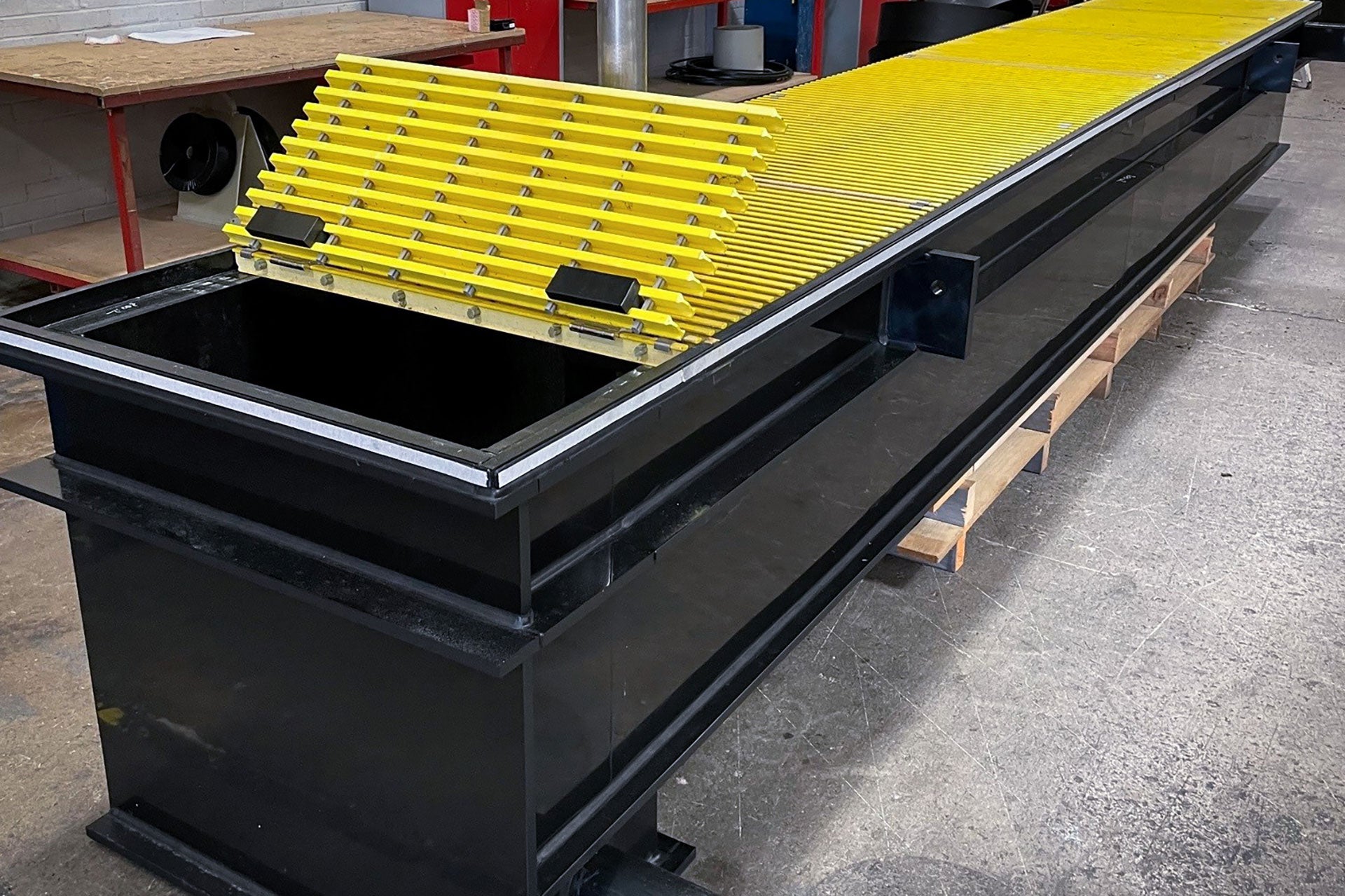 Image of a Pipex drainage channel and floor drain on a facility floor