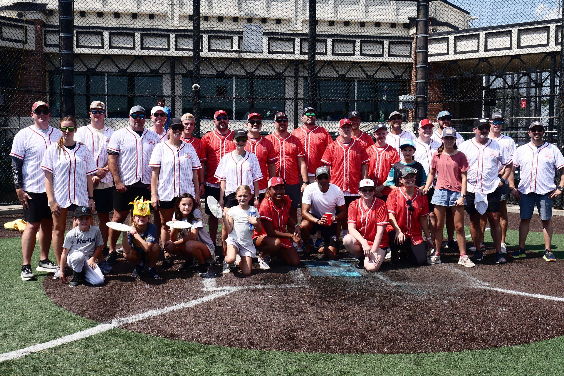 Team posed at home base at Derricks and Diamonds softball charity tournament