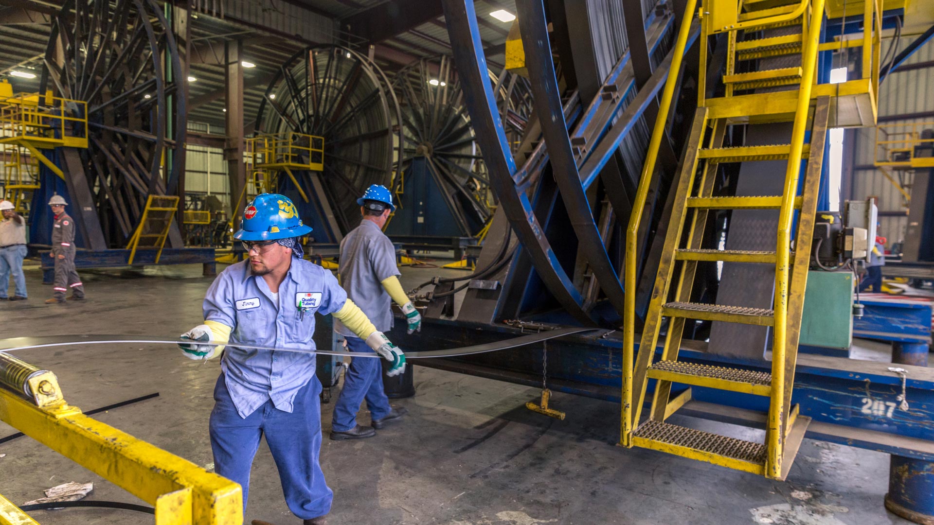 Technicians at a quality tubing facility