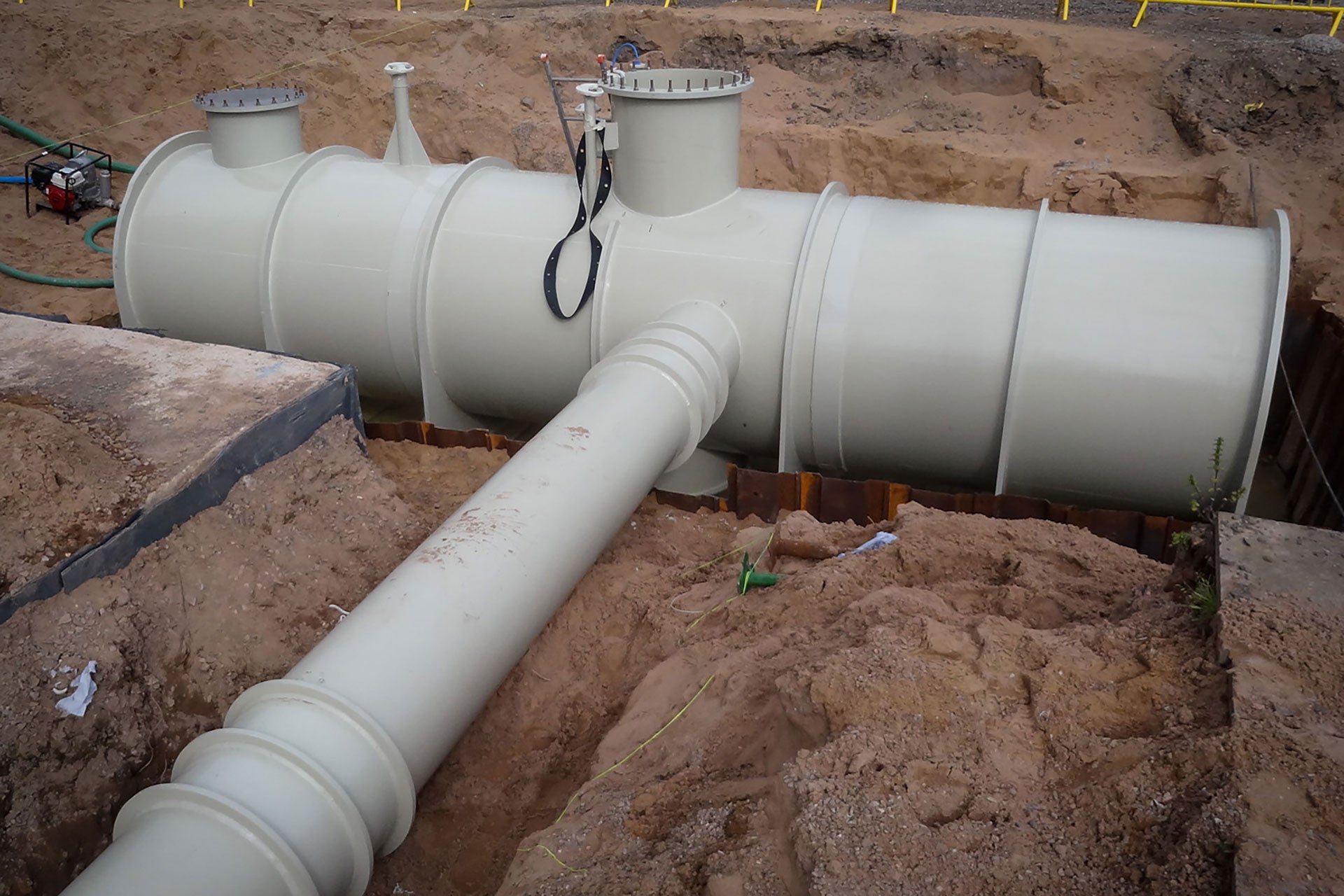 Fiber glass piping being installed underground