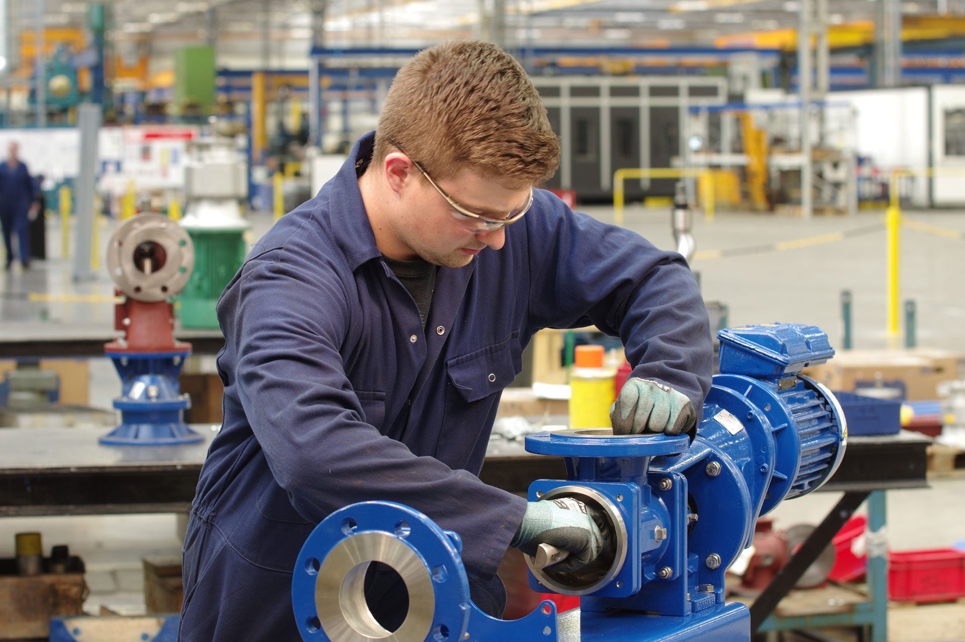 Technician working on an EZstrip at a facility