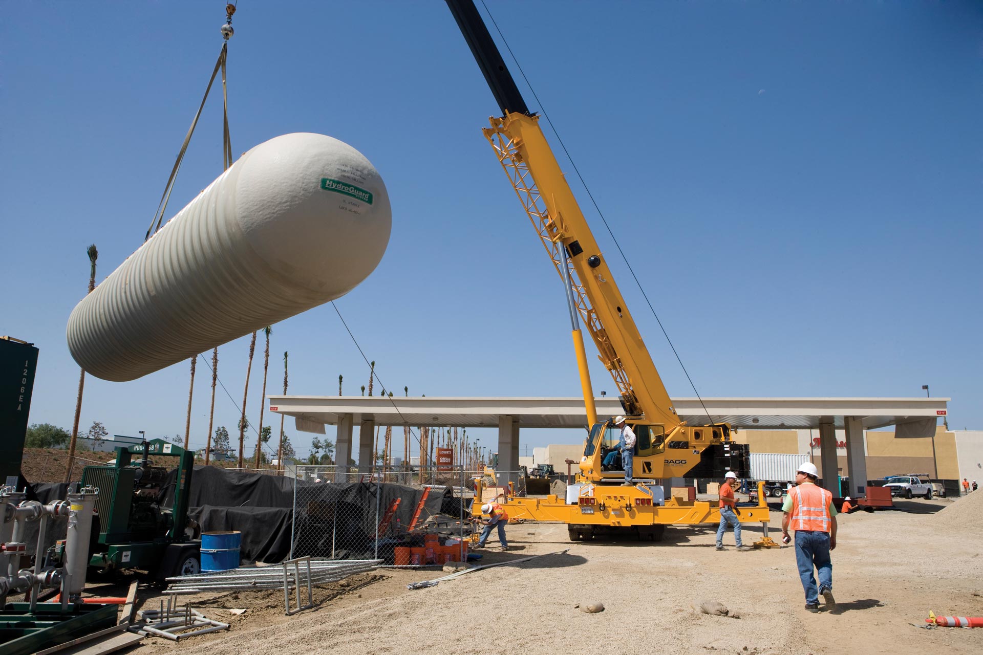 HydroGuard tank on jobsite being lifted by a crane. 