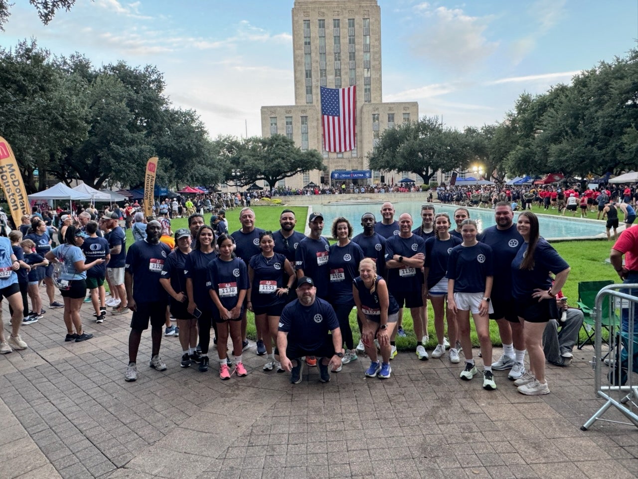 Group photo in front of Houston City Hall with the water feature in the near background