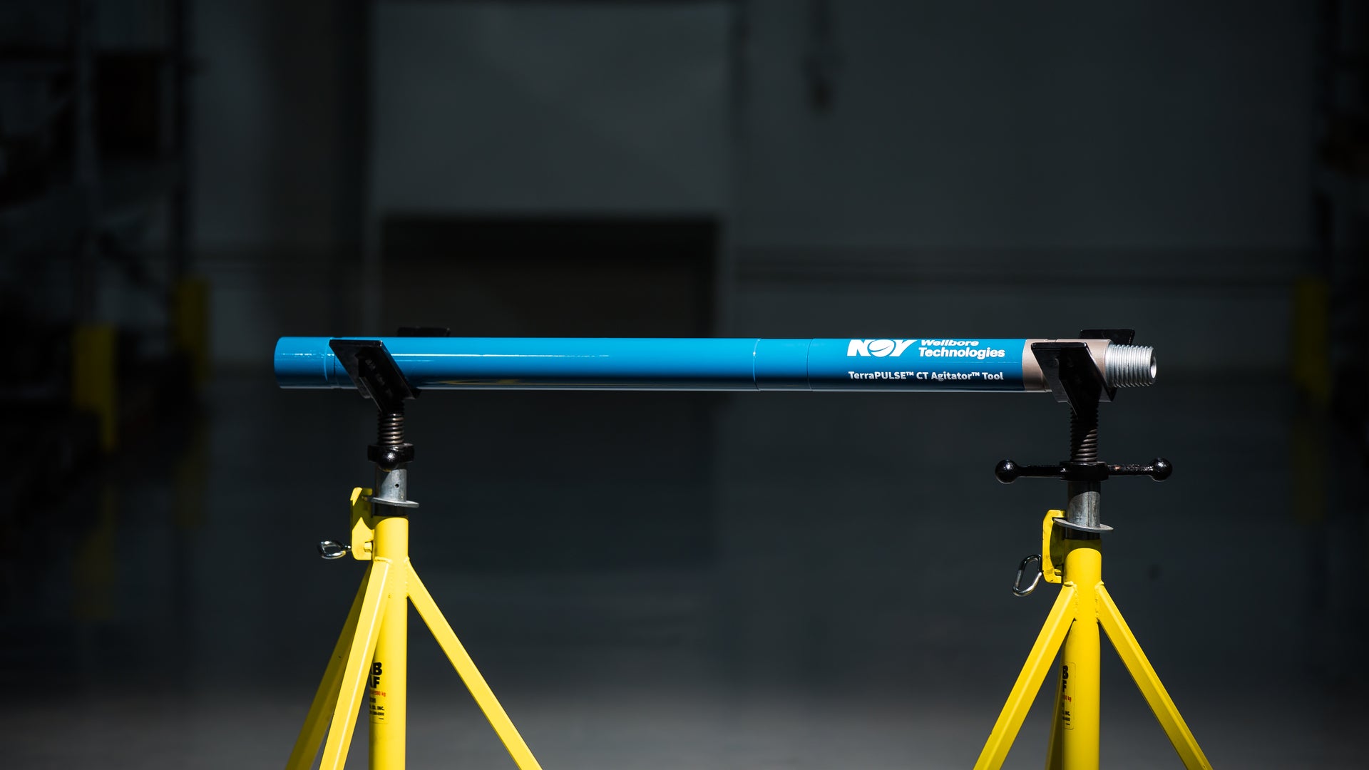 A single CT Agitator on stands in a dark facility