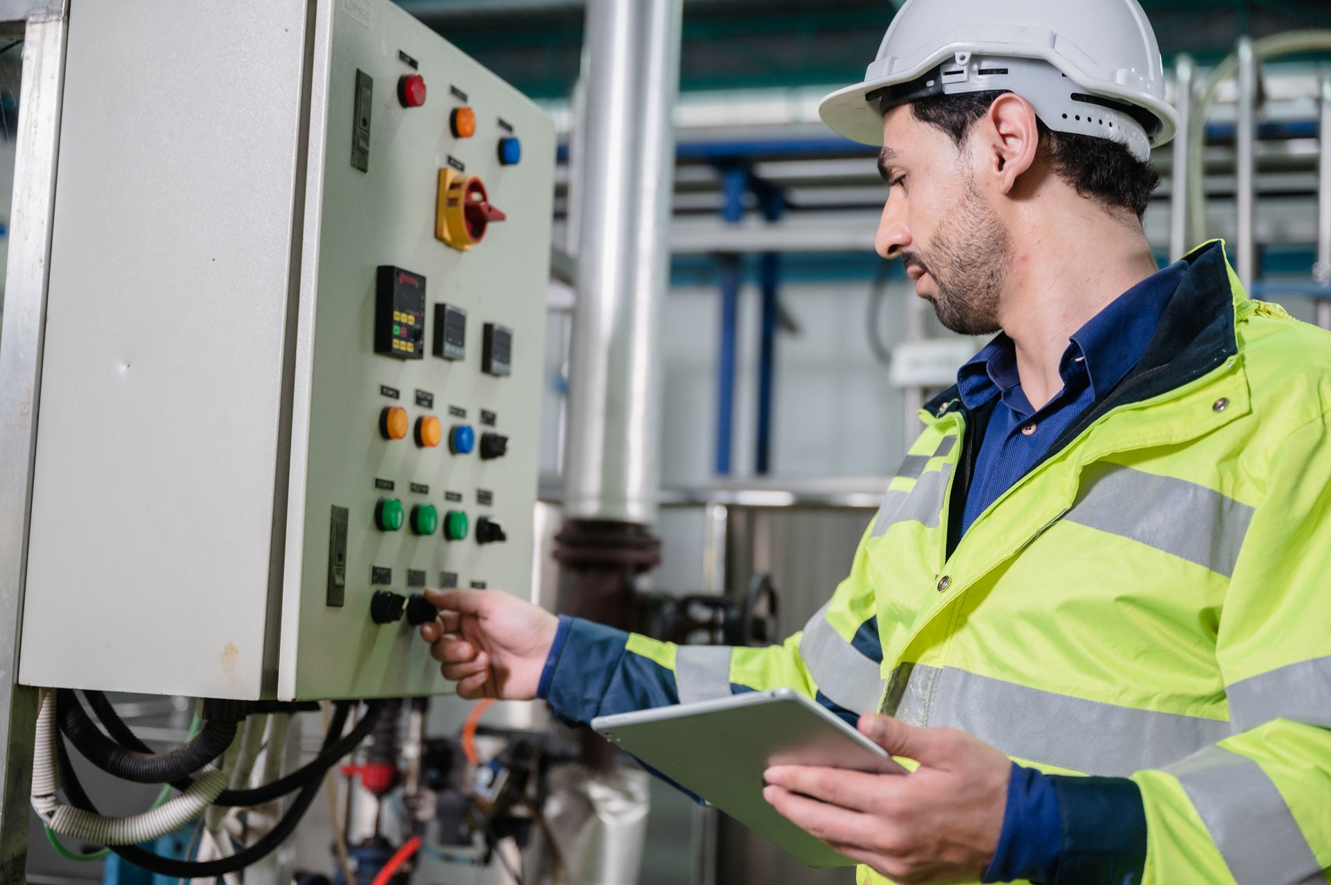 Procon employee analyzing data at a meter