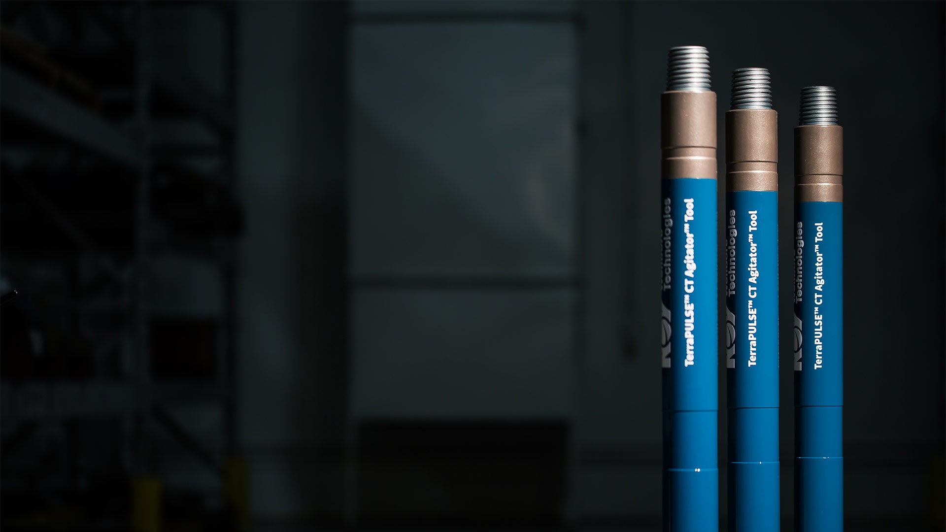 Three TerraPULSE CT Agitator Tools standing upright to the far right with a dark background