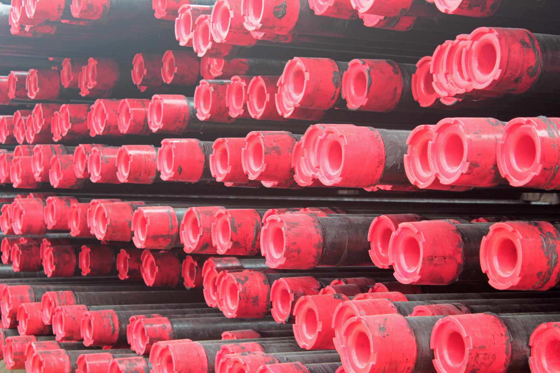Red Magnum Casing Thread Protectors in yard