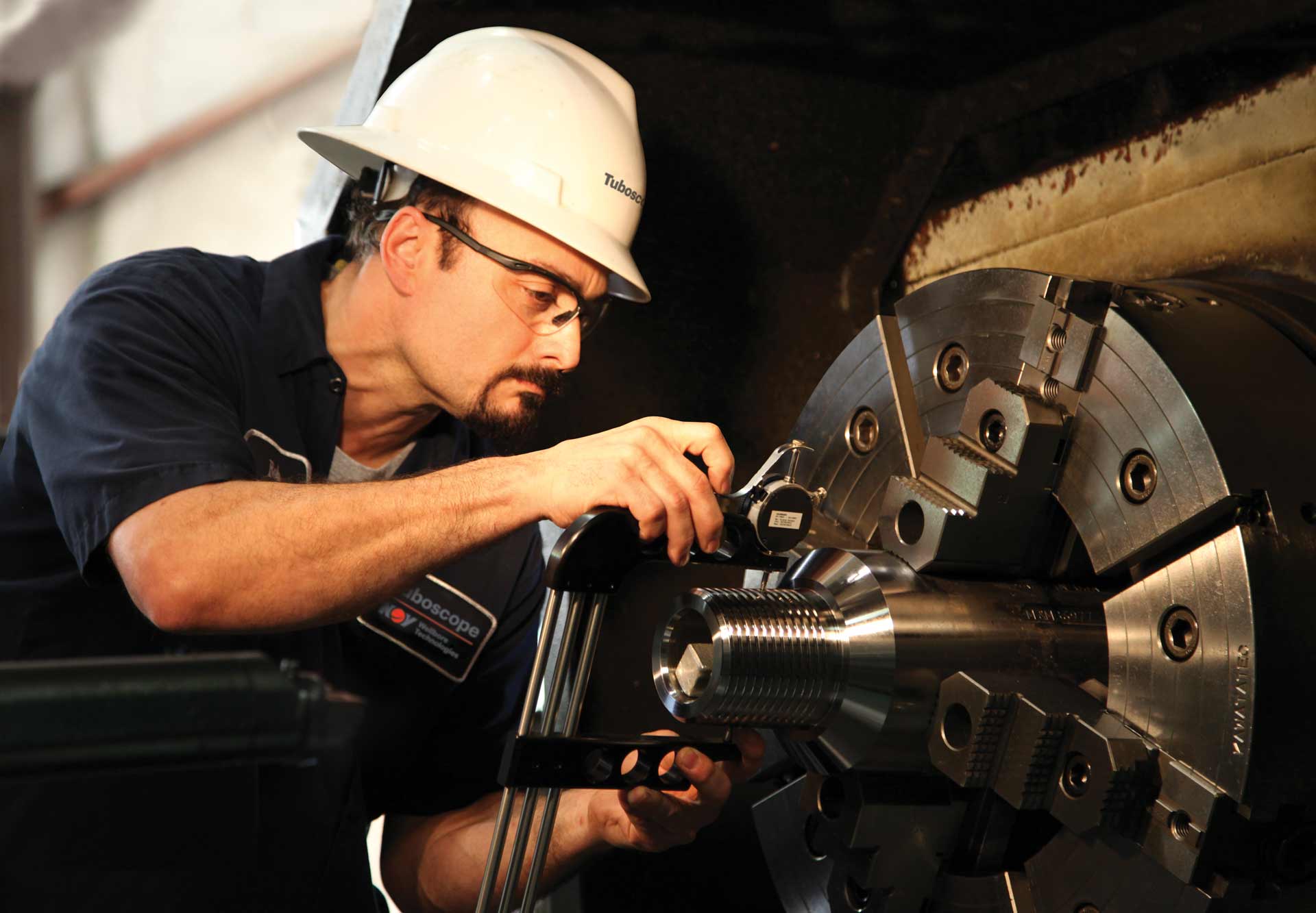 A technician works on a piece of machinery