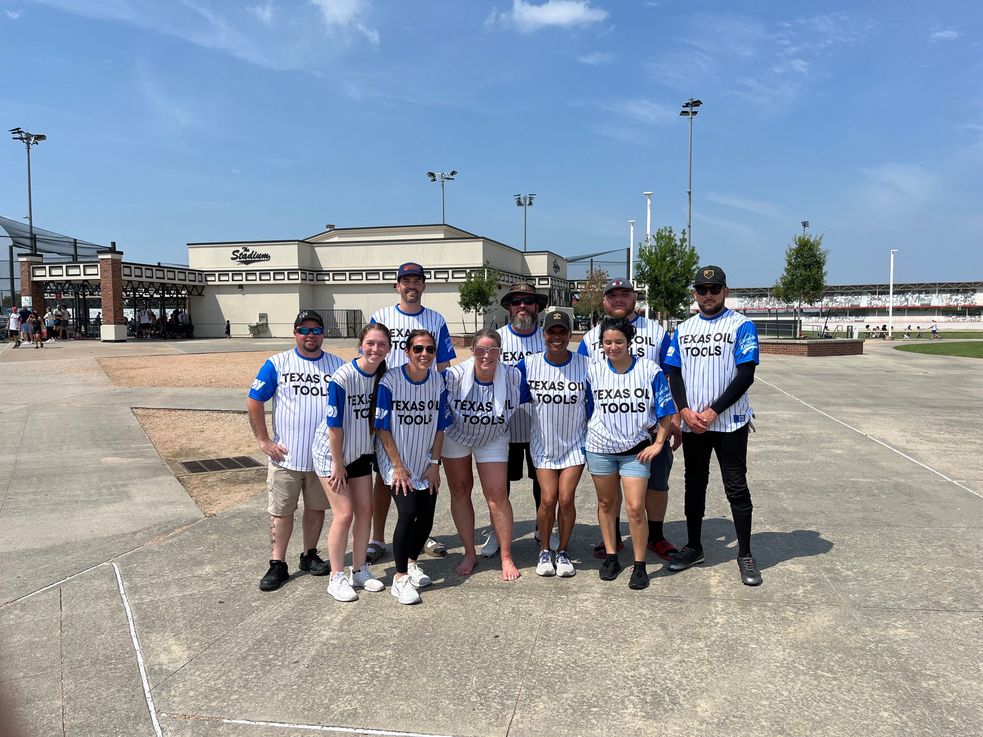 TOT team posed at Derricks and Diamonds softball charity tournament