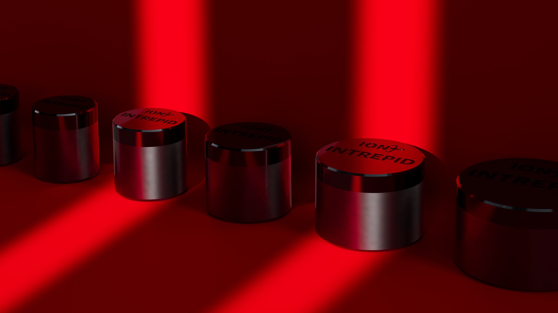 Graphic of several Intrepid PDC Cutters lined up against a wall with two spotlights shining on them, all shaded in red