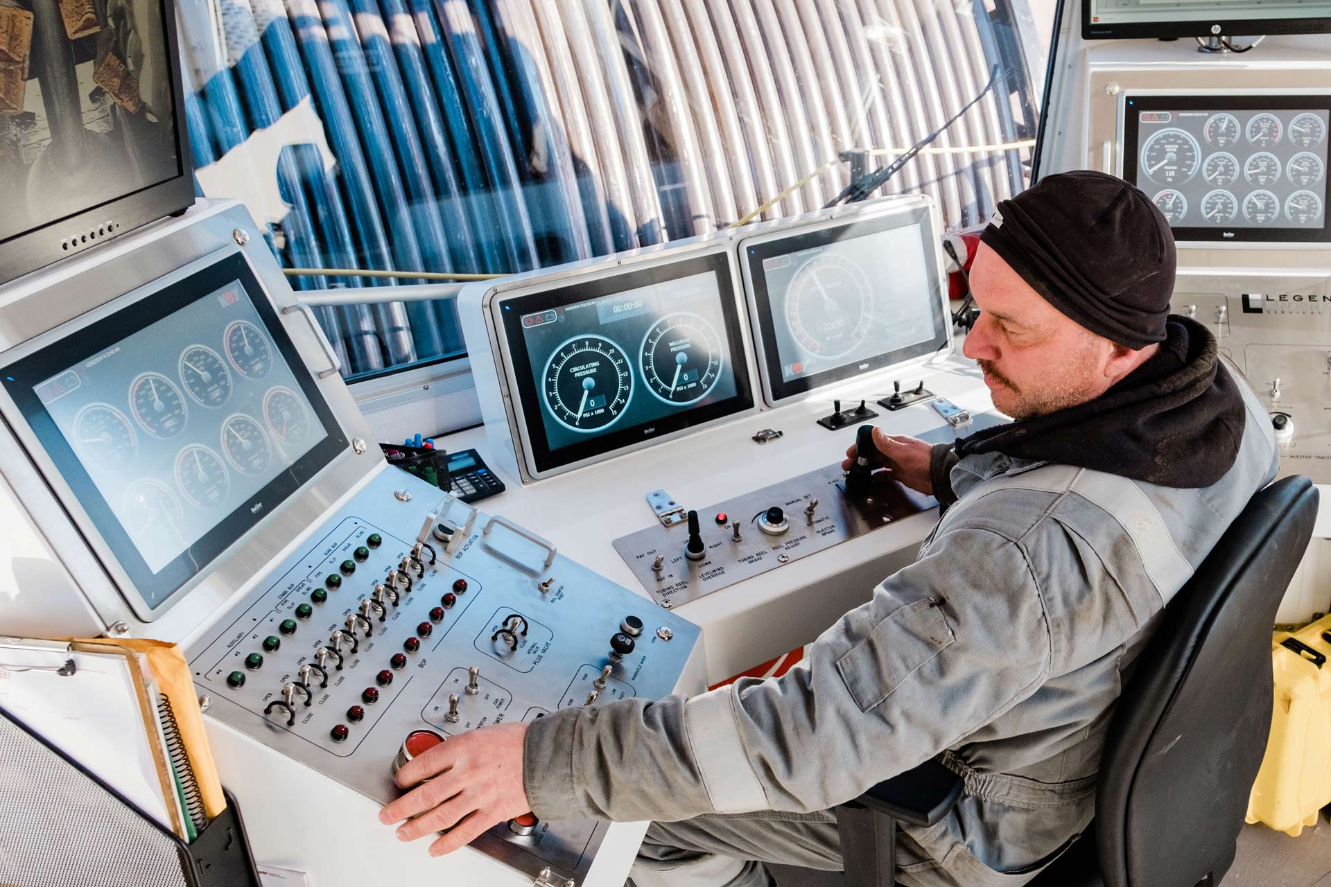 A technician works in a High Visibility XL Control Cabin