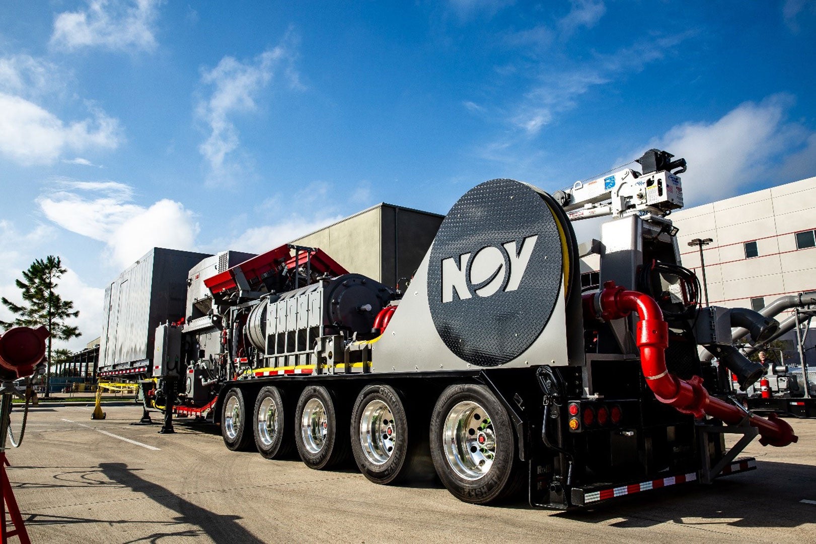 Image of an Ideal eFrac fleet truck in front of an NOV facility