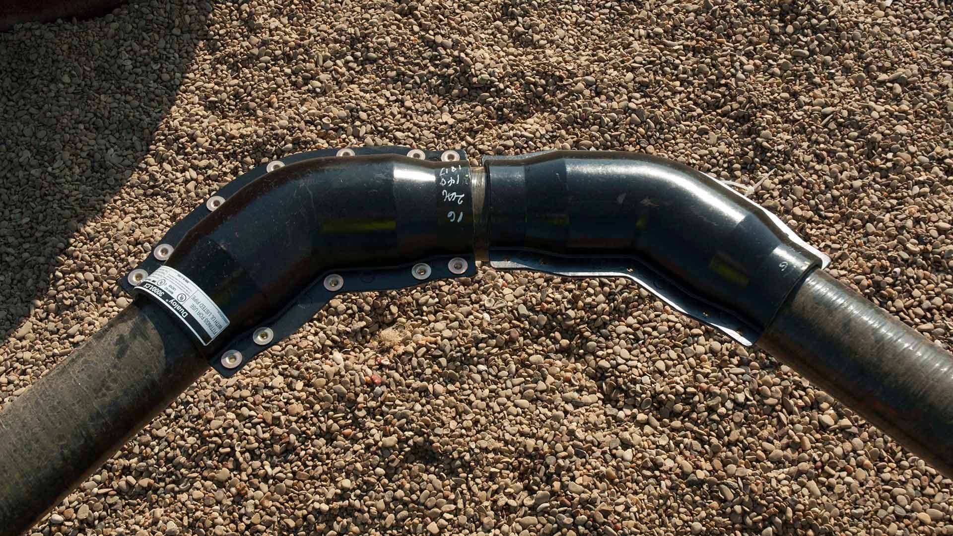 A closeup of Dualoy Fiberglass Piping Connection