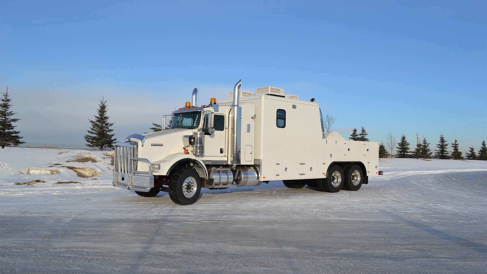 A side view of an iMaxx series logging truck