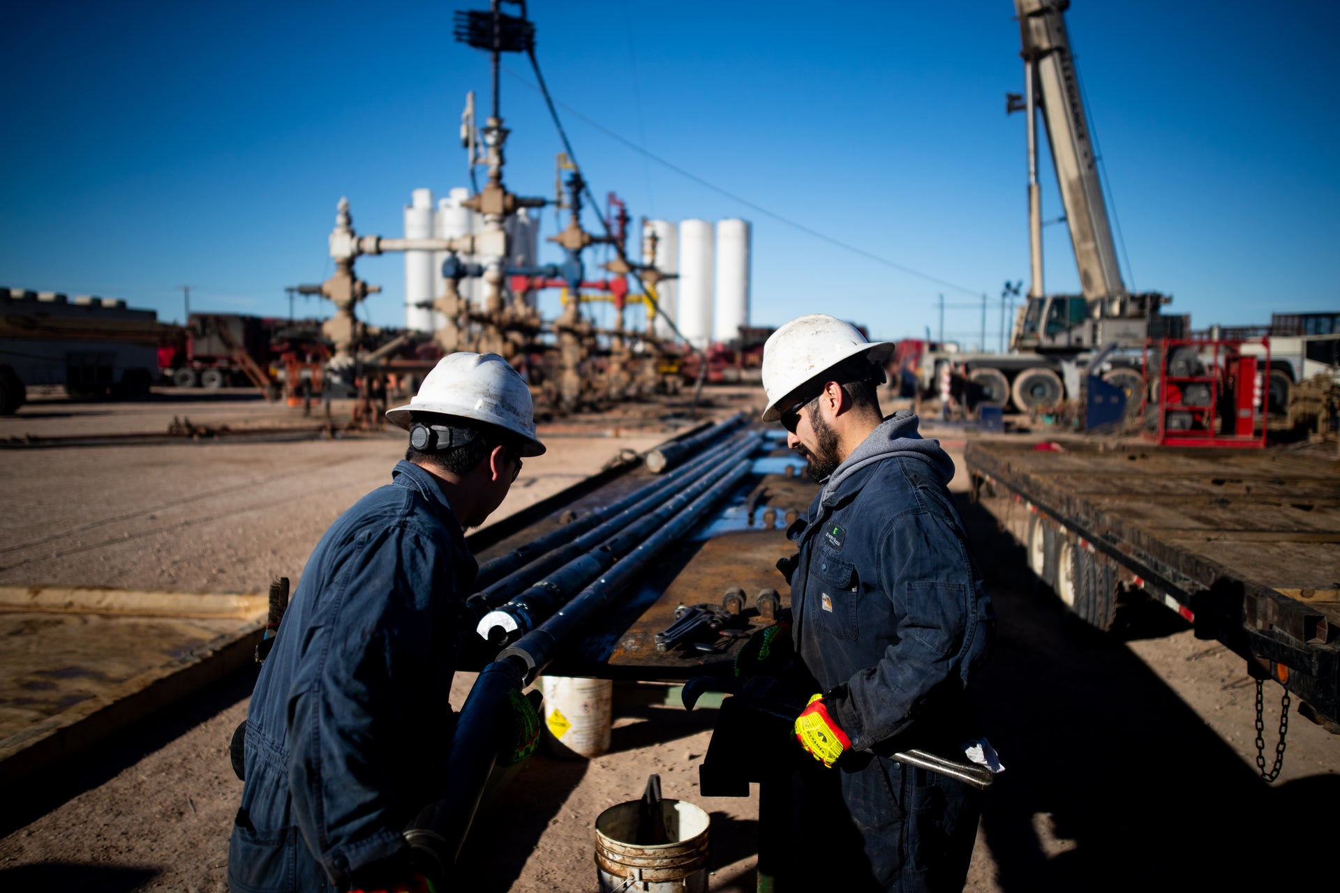 Fortress field technicians prepare Fortress setting tools at an oilfield wellsite.