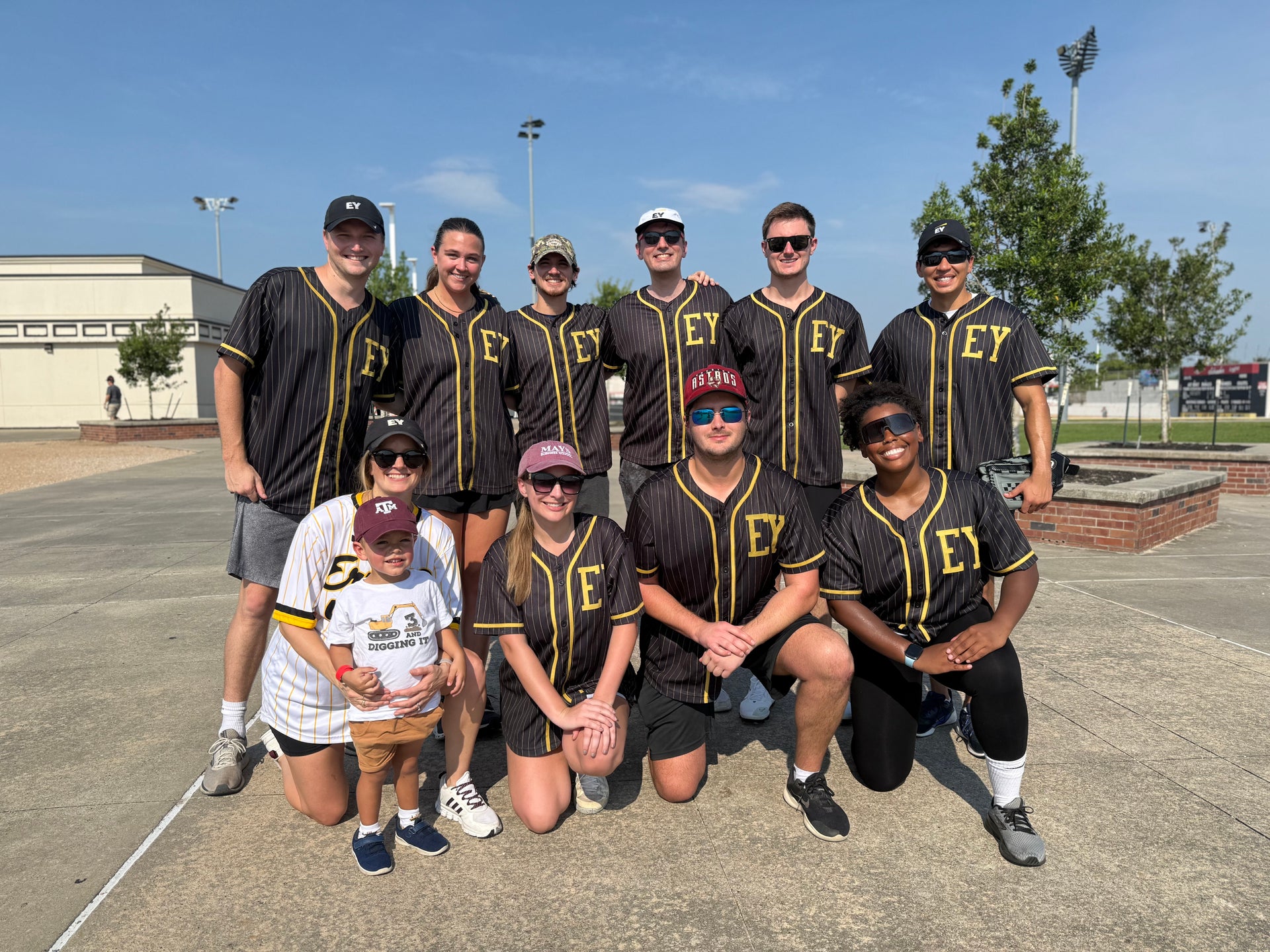 EY team posed at Derricks and Diamonds softball charity tournament