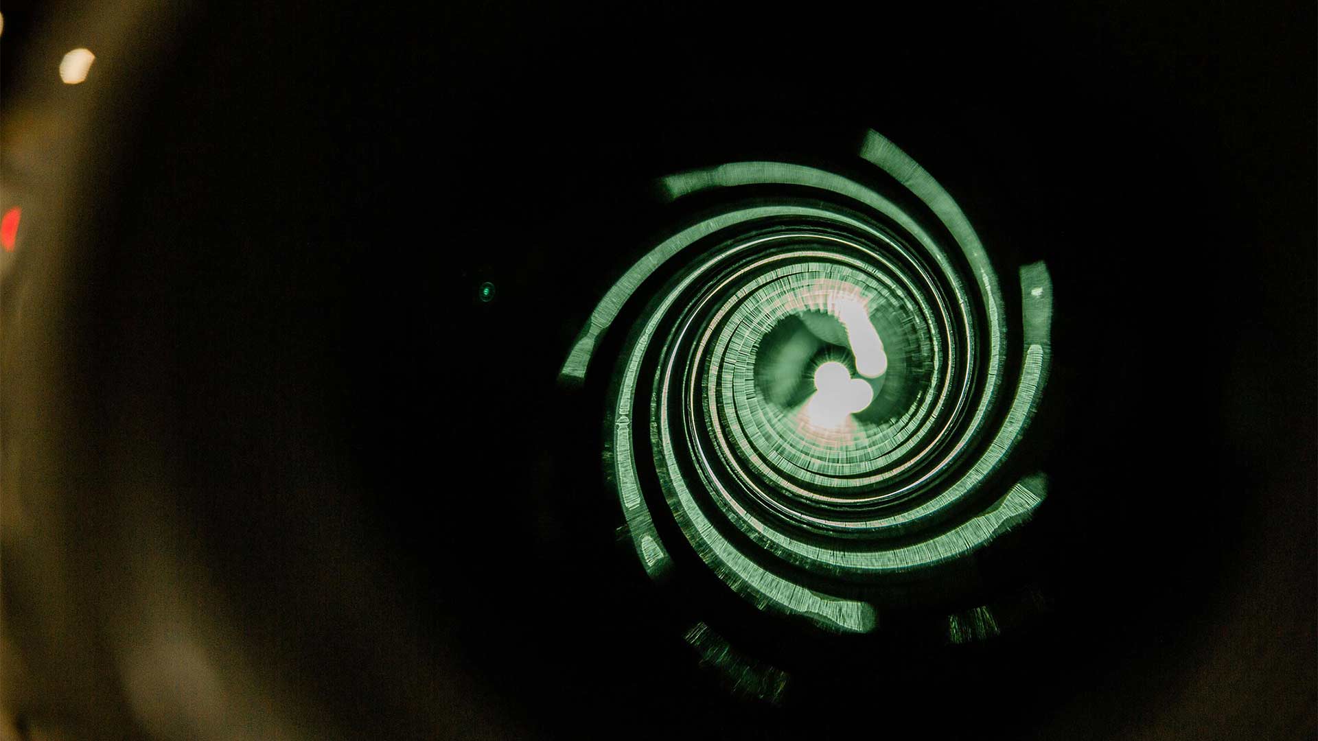 Close up shot of the inside of a stator with a green light glowing