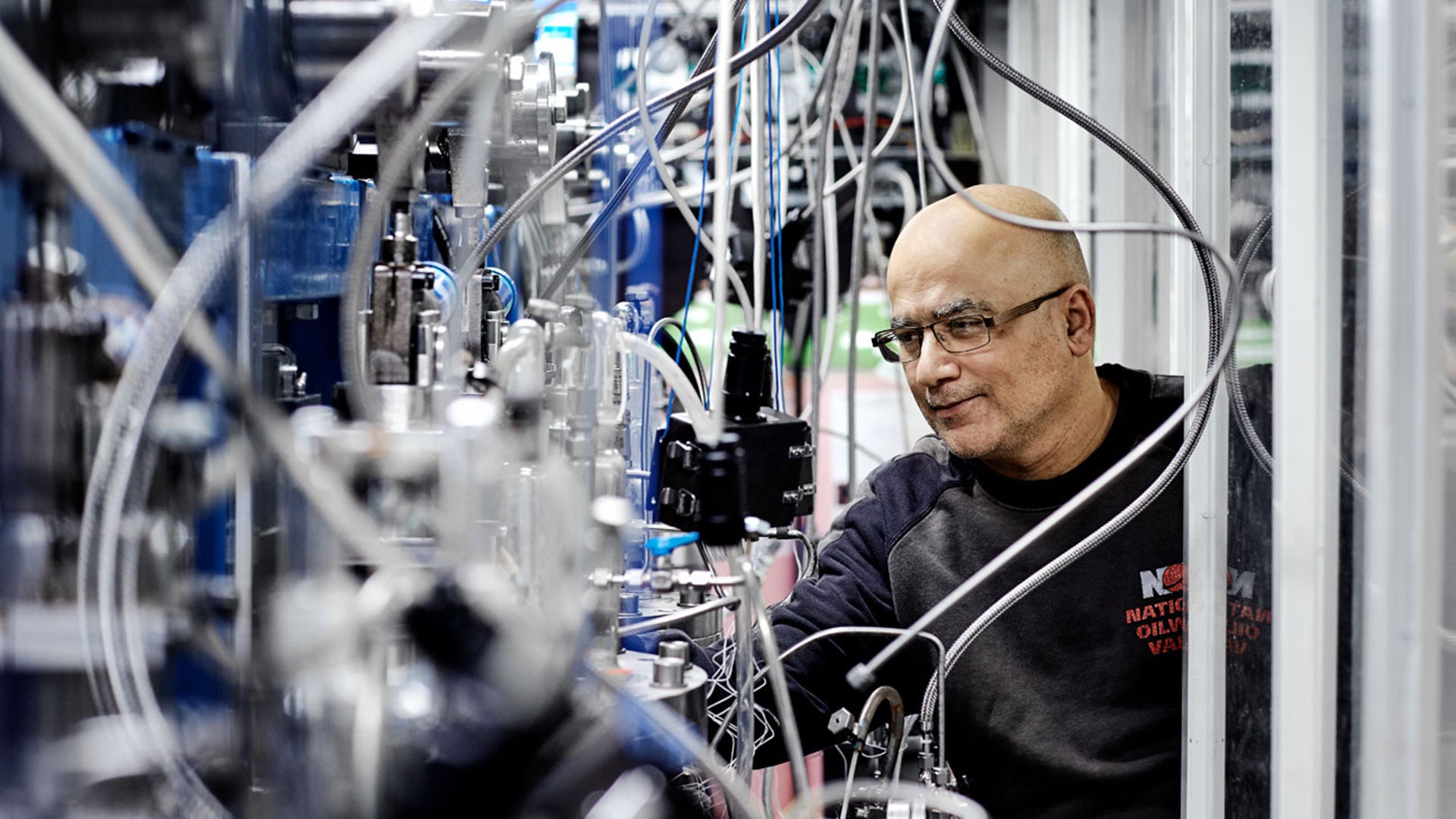Worker assessing Flexibles pipe in in-house laboratory