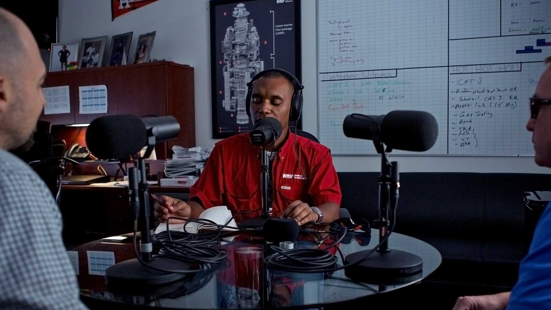 Podcast host Michael Gaines speaks and records with other NOV members